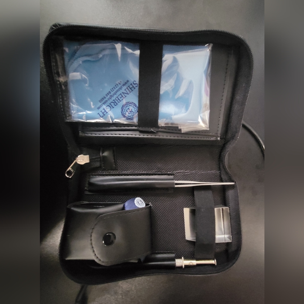 Leather jewelery care set with tweezers, metal tray, magnifier and other
